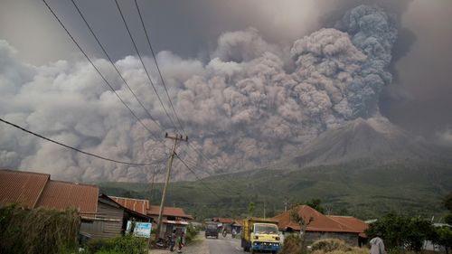 Mount Sinabung spews volcanic ash as it erupts in Kutarakyat, North Sumatra, Indonesia