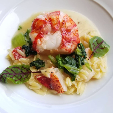 Alan Wong's Butter Poached Lobster with Orzo Pasta and Garlic Black Pepper Butter.