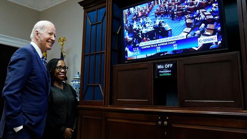 President Joe Biden and Supreme Court nominee Judge Ketanji Brown Jackson watch as the Senate votes on her confirmation from the Roosevelt Room of the White House.