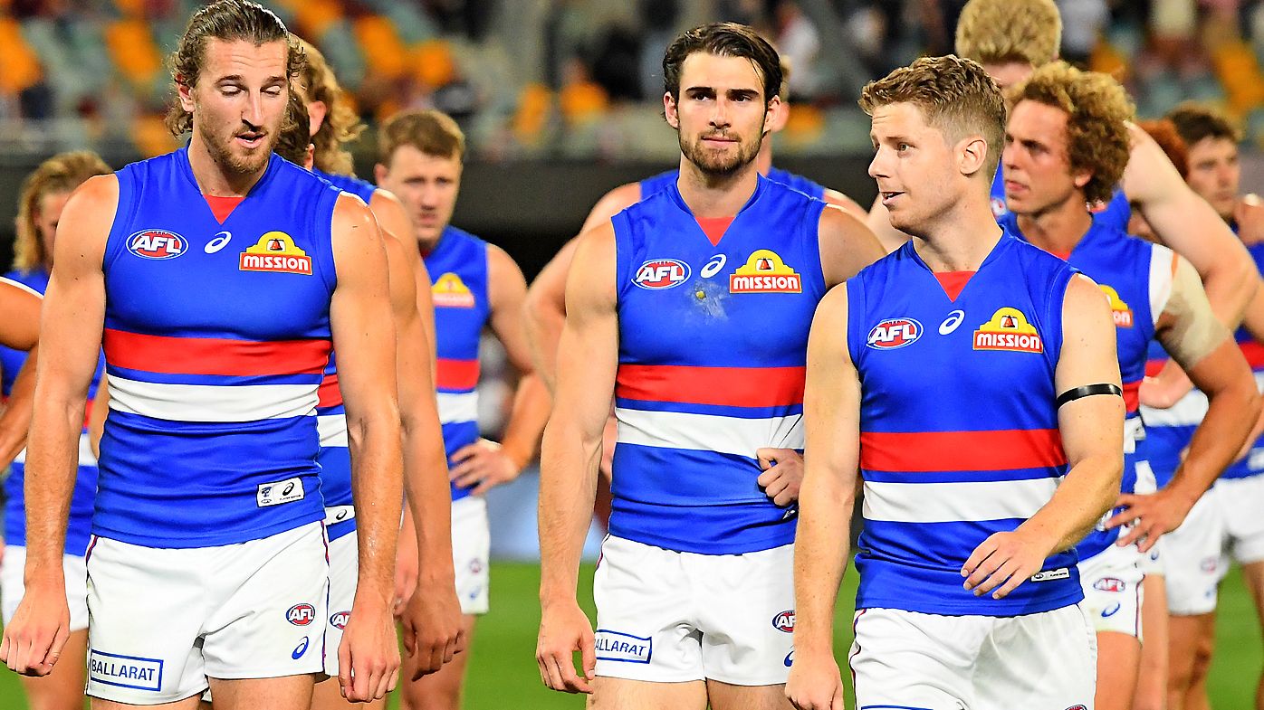 The Bulldogs are dejected after they were defeated by the Saints 
