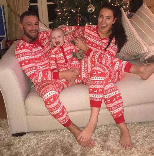 McGregor in a Christmas photograph with his partner and son. (Instagram/thenotoriousmma)
