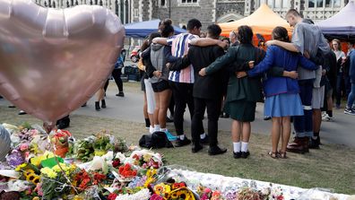 Students embrace at Botanical Gardens in Christchurch