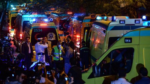 Ambulances carrying the bodies of the victims arrive in Cairo. (AAP)