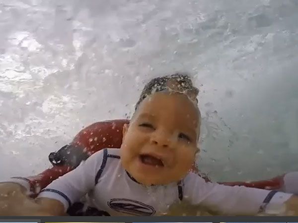 Baby bodyboarder shoots the curl