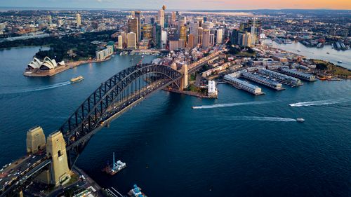 Climbing the Sydney Harbour Bridge is a popular tourist activity.