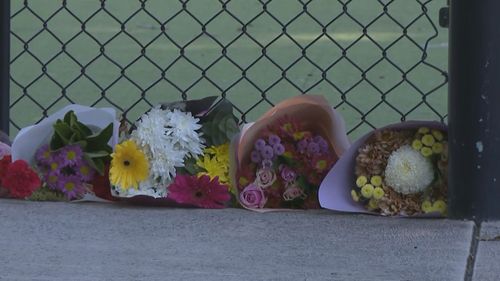 ï»¿Flowers have been left at the nets by mourners in the intervening days.