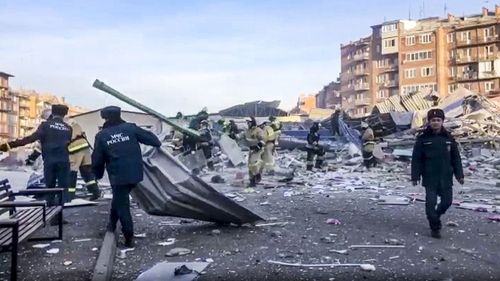 Russian Emergency Ministry employees work at a scene of a powerful explosion in Vladikavkaz, Russia, Friday, Feb. 12, 2021