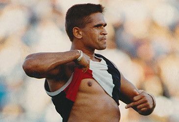Nicky Winmar famously responded to racial vilification from which club's fans whith the gesture illustrated above?