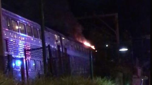 At least 60 passengers were evacuated after the train caught fire. (Timothy Wells/Facebook)