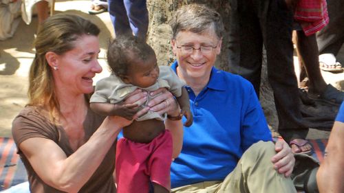 Melinda and Bill Gates meet with members of the Mushar community in India during a 2011 visit. (AAP)