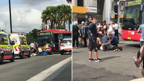 A woman, 81, was frantically helped by bystanders after being hit by a bus in Bankstown (Supplied).