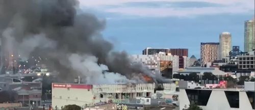 More than 40 firefighters are on the scene to tackle the fire, which broke out in an abandoned warehouse in south Melbourne.