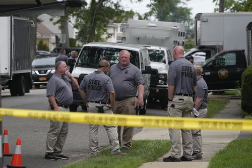 Authorities continue to work at the home of suspect Rex Heuermann in Massapequa Park, N.Y., Monday, July 24, 2023.