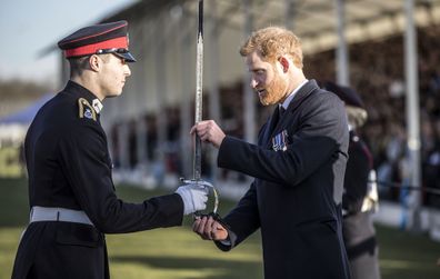 Britain's Prince Harry presents the sword of honour to the best overall officer cadet at The Royal Military Academy Sandhurst.