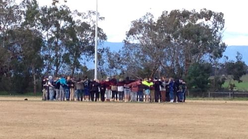 The Yarra Glen Football Club community gathered to pay tribute to Cooper Ratten. (9NEWS)