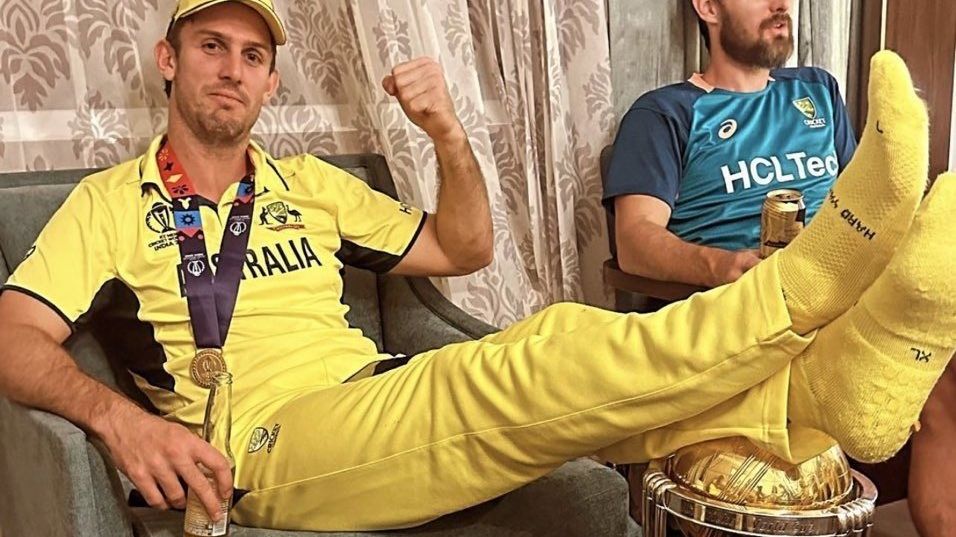 Mitchell Marsh with his feet resting on the World Cup trophy after Australia&#x27;s victory over India.