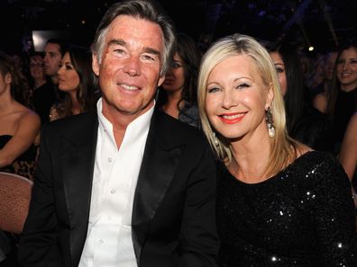 Singer Olivia Newton-John and husband John Easterling attend the 2013 American Country Awards at the Mandalay Bay Events Center on December 10, 2013 in Las Vegas, Nevada.