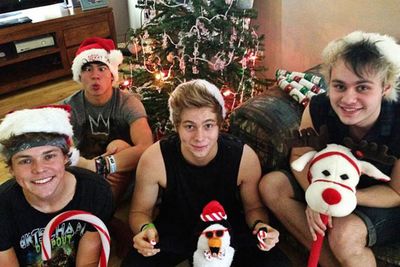 Too cool for Christmas? Not the guys in 5 Seconds of Summer. Erm, better be careful, Callum. You don't want your eyes to stay that way.