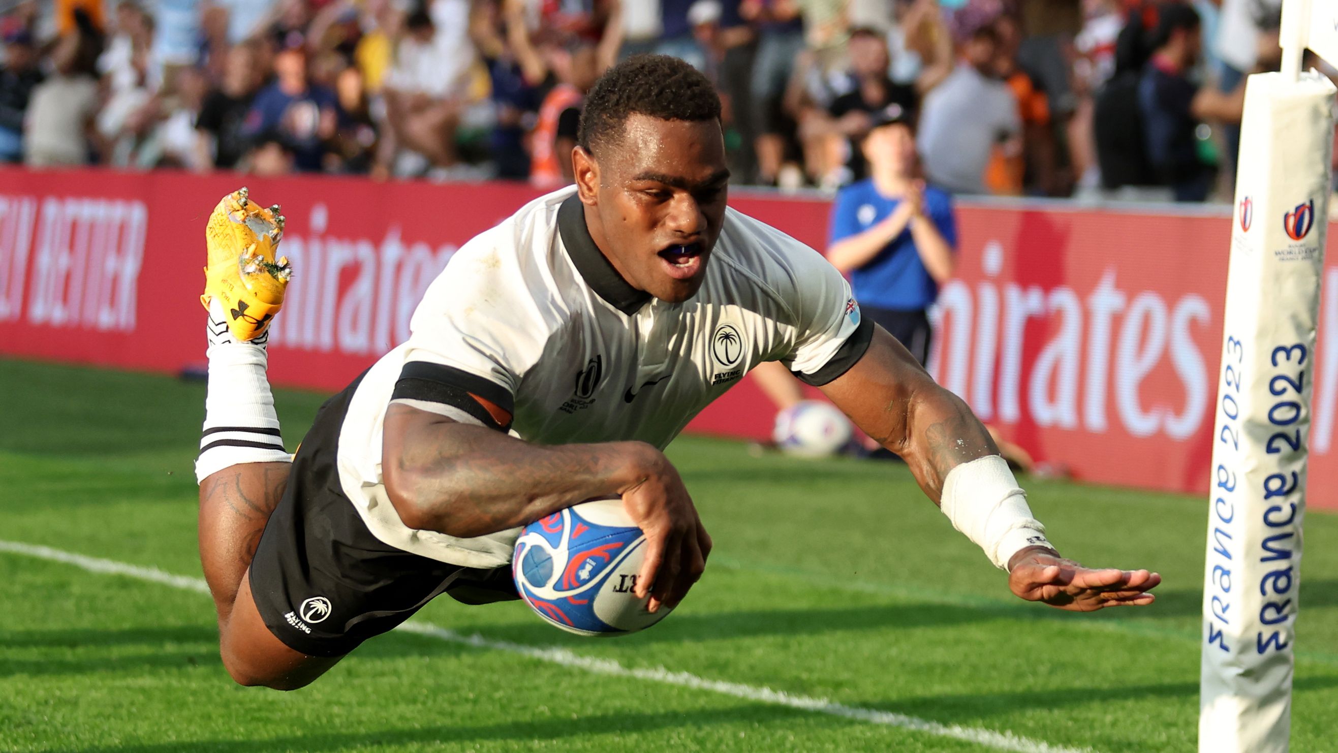 Josua Tuisova of Fiji scores his team&#x27;s first try during the Rugby World Cup against Australia.
