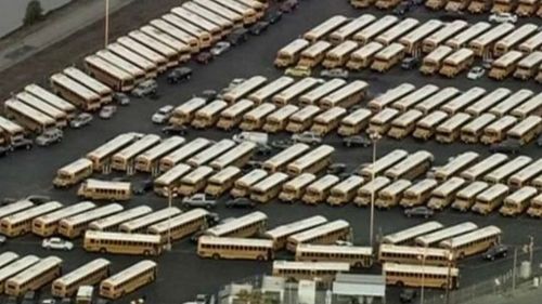 Los Angeles school buses sit parked. (CBS News)