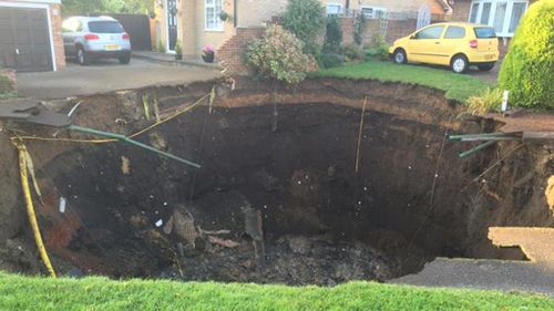 Giant sinkhole forces London families from their homes 