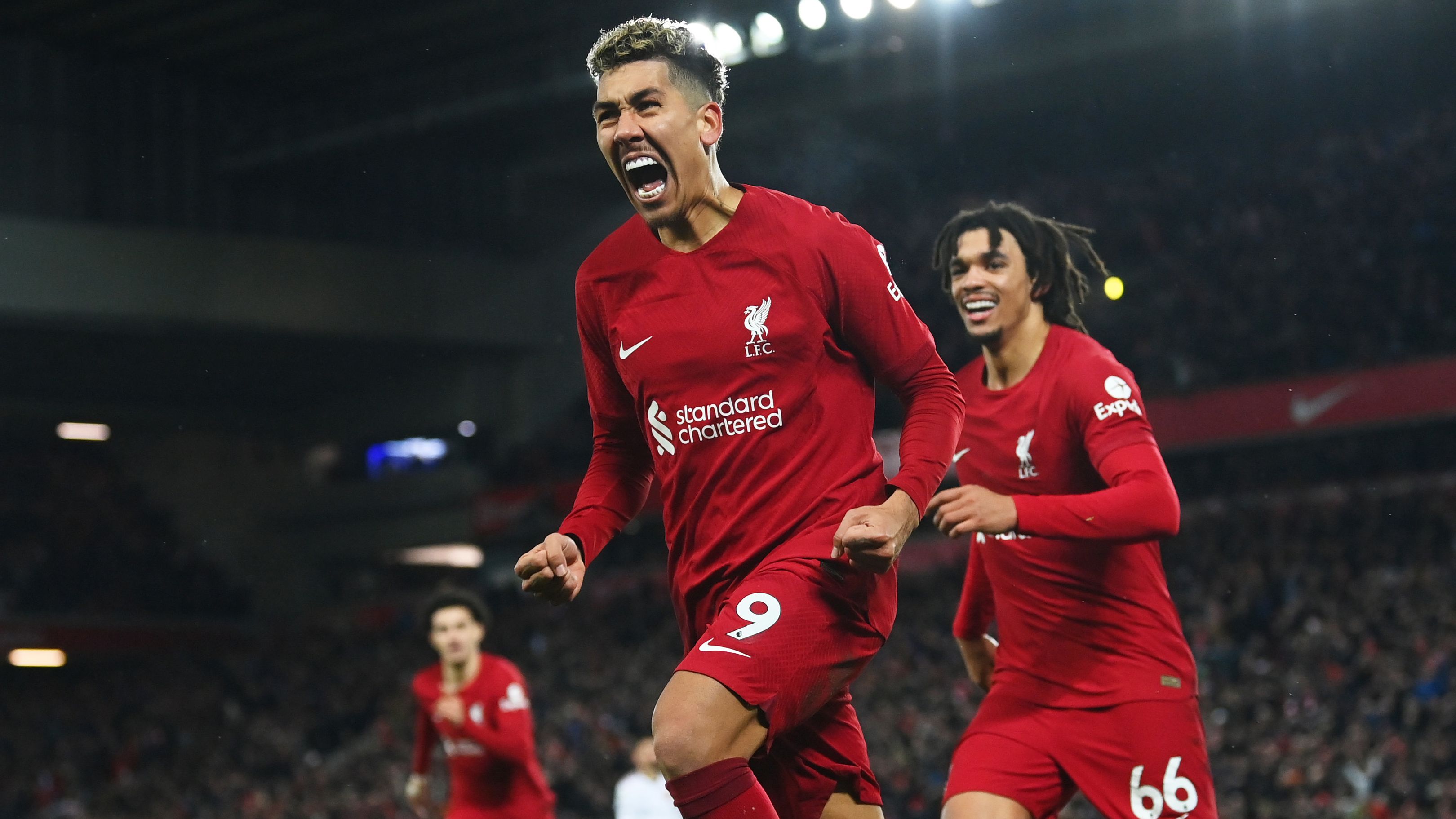 Roberto Firmino celebrates after scoring the team&#x27;s seventh goal with teammate Trent Alexander-Arnold during the Premier League match between Liverpool FC and Manchester United.