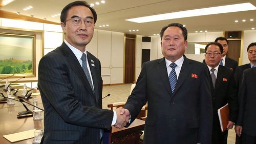 South Korean Unification Minister Cho Myoung-gyon, left, shakes hands with the head of North Korean delegation Ri Son Gwon after their meeting at Panmunjom. (AP).