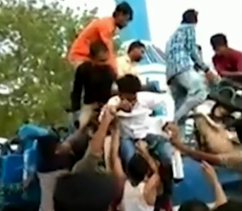 People rush to help those stuck on the ride. 