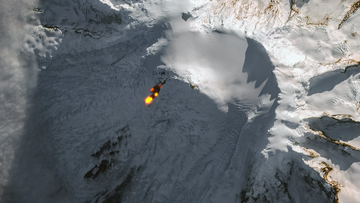 Lava is seen spilling down the side of Mawson Peak, one of Australia&#x27;s only active volcanoes.