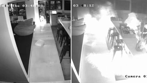 CCTV has captured the moment two arsonists set St Kilda restaurant Republica on fire. (Supplied)