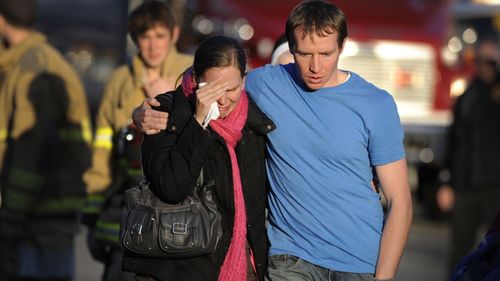 Alissa Parker, left, and her husband, Robbie Parker, after receiving word that their six-year-old daughter Emilie was one of the 20 children killed.