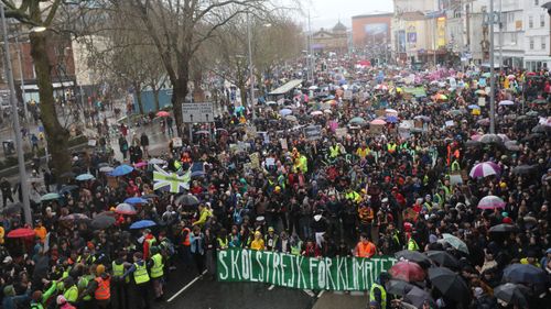 A general view as Greta Thunberg (bottom, yellow coat) takes part the Bristol Youth Strike 4 Climate protest at College Green in Bristol.