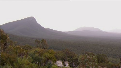 The man trekked to the top of Bluff Knoll to look at the snow.