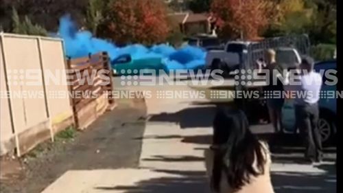 Vision has emerged of a ute pulling the daring stunt metres away from a pregnant woman. (9NEWS)