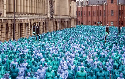 In May Tunick flooded the streets of Hull, a city in the UK, with people painted shades of blue. Picture: AAP