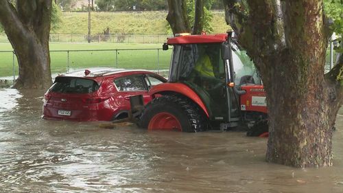 A man had to be rescued with a tractor after becoming stuck in flood waters in Lithgow.