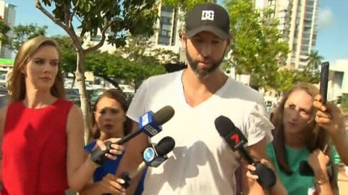 Grant Hackett is questioned by reporters after he was released by police.