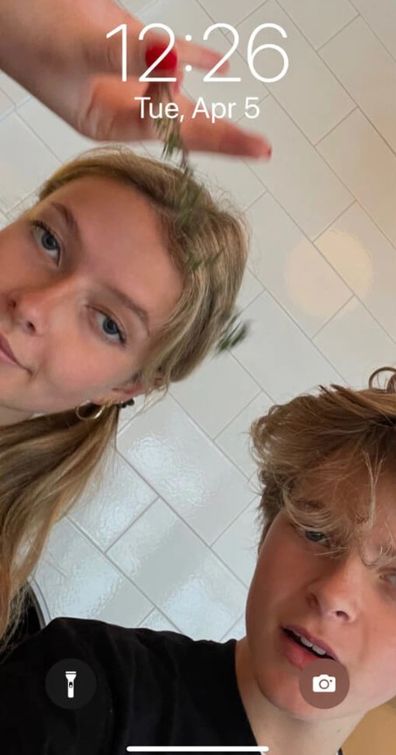 Gwyneth Paltrow's children Apple and Moses pose for a selfie on her lock screen.