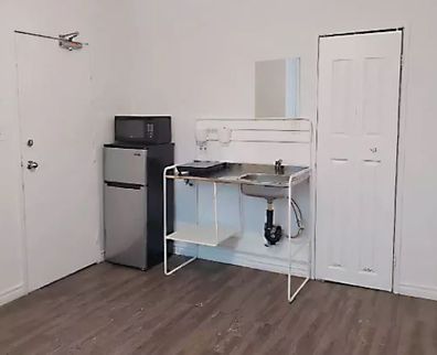 This listing on Canadian real estate site Kijiji listed a very small Toronto unit for the equivalent of $1200 a month. The kitchen was a hotplate and sink.
