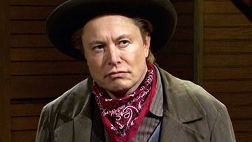 Elon Musk, seen here dressed as a cowboy on Saturday Night Live, said he expects his staff to be in the office a minimum of 40 hours a week.