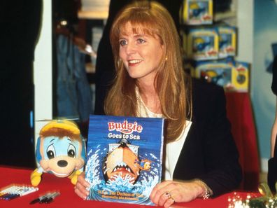 The Duchess of York holds one of her Budgie books.