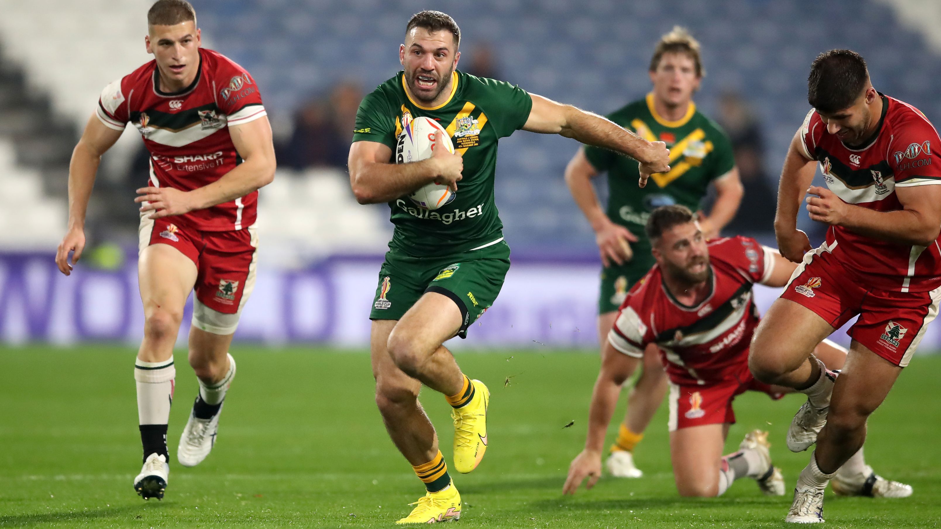 James Tedesco runs with the ball.