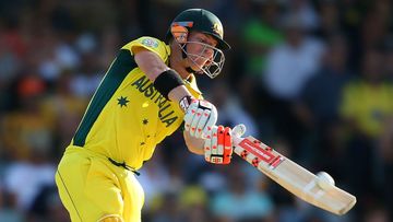David Warner smashes a ball during Australia's World Cup match with Afghanistan. (Getty)
