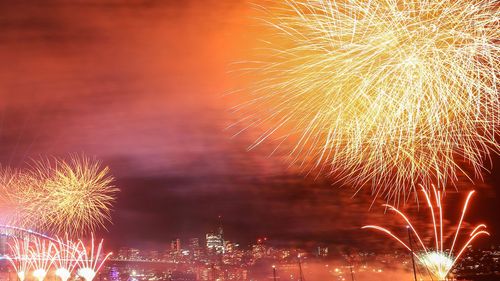 Fireworks light up the sky over Sydney Harbour Bridge during New Year's Eve celebration on January 01, 2023 in Sydney, Australia.