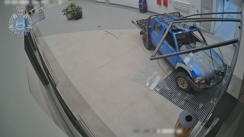 Cameras captured the moment thieves rammed through the doors of a shopping center in the dead of night and stole an ATM.