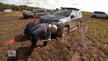 Hundreds of festival-goers in Melbourne had to sleep in their cars after heavy rain turned a festival into a quagmire of mud.A Day on the Green was held at Mt Duneed Estate near Geelong, south west of Melbourne last night.