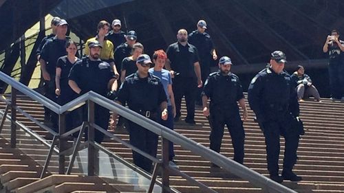 Five climbers scaled the Sydney Opera House to protest the treatment of refugees on Manus Island on Thursday. (9NEWS)