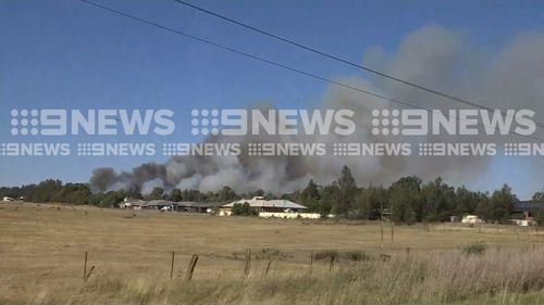 Townships around Singleton and the New England Highway are being threatened by flames as catastrophic fires sweep parts of NSW and Queensland.