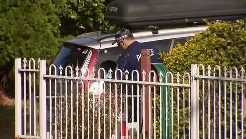 Forensic officers were seen dusting a car out front of the home for prints this morning. (9NEWS)