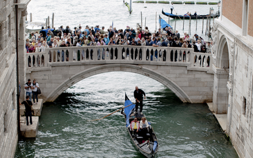Venice overtourism: bridge crowded with tourists